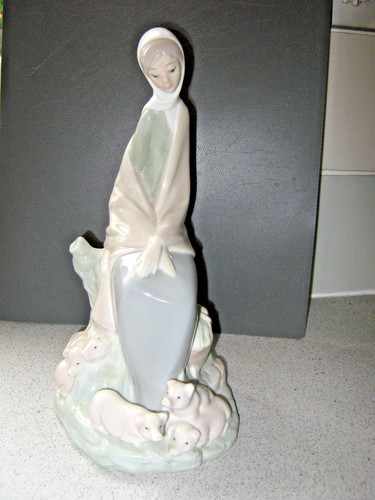Nao lladro figurine - by,